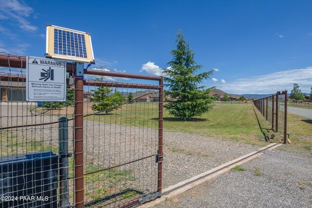 view of gate with a mountain view