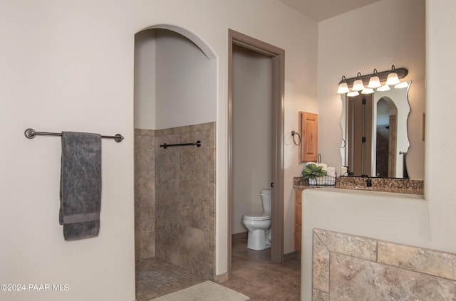 bathroom featuring tile patterned flooring and toilet