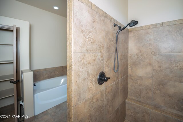 bathroom with independent shower and bath