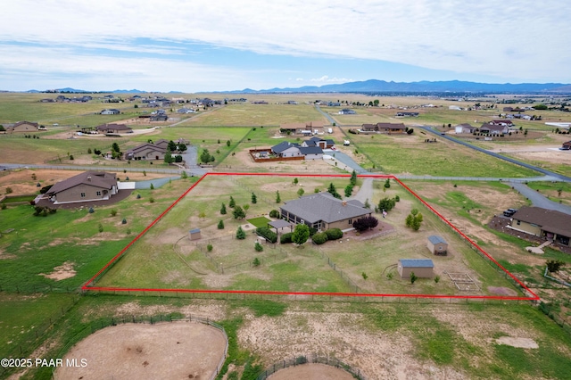 drone / aerial view with a mountain view and a rural view