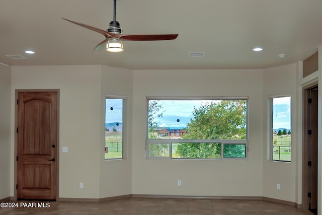 unfurnished room featuring ceiling fan