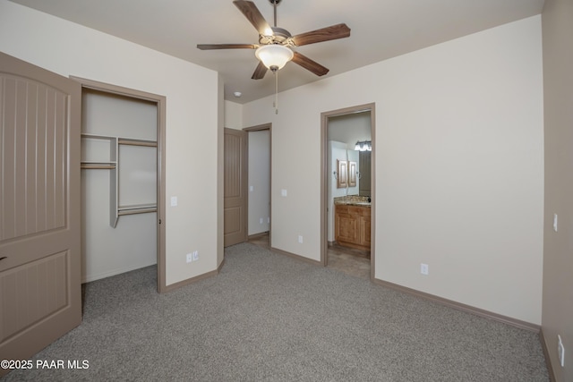 unfurnished bedroom with ceiling fan, light colored carpet, connected bathroom, and a closet