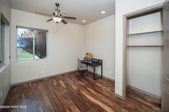 bedroom with dark hardwood / wood-style floors and ceiling fan