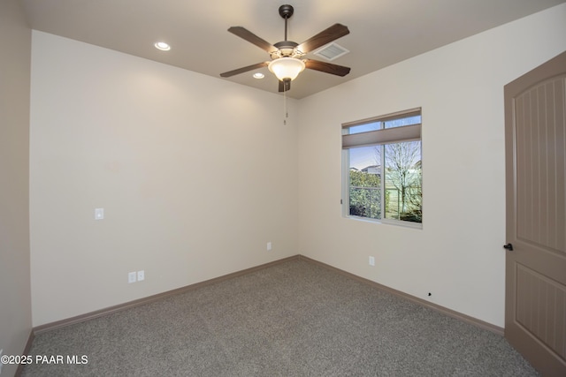 carpeted empty room with ceiling fan