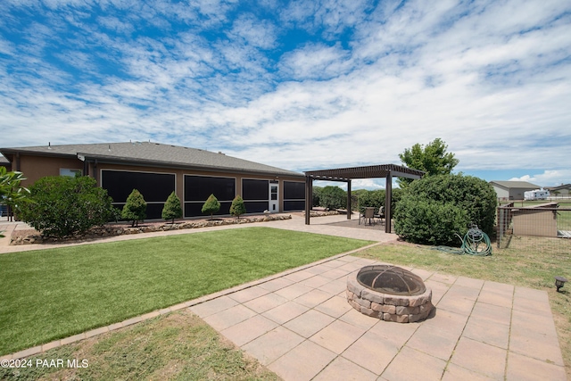 exterior space with a fire pit, a patio area, and a pergola