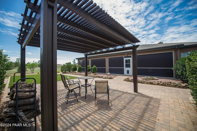 view of patio featuring a pergola