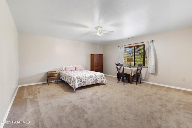 carpeted bedroom featuring a ceiling fan and baseboards