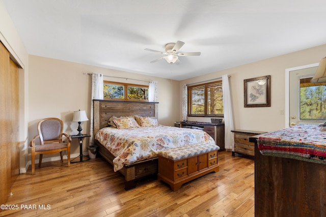 bedroom with ceiling fan, a closet, and light wood-type flooring