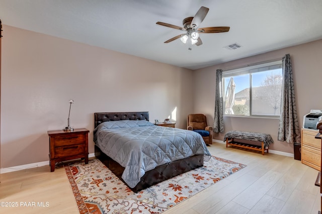 bedroom with light wood-type flooring and ceiling fan