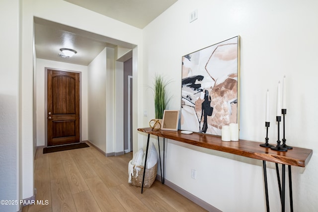 foyer with light hardwood / wood-style flooring