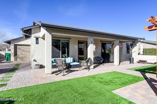 rear view of property with a patio and a yard