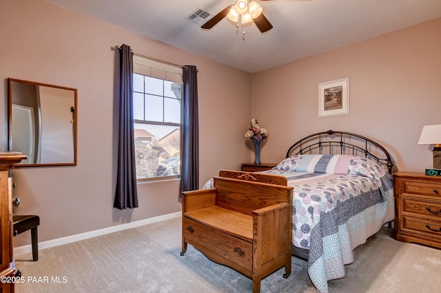 bedroom featuring light colored carpet and ceiling fan