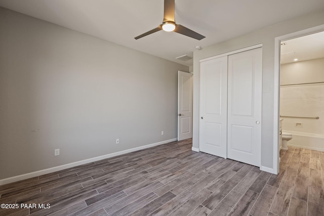 5268 Tranquil Bluff Way, Prescott, AZ 86301 - unfurnished bedroom with wood finished floors, a closet, baseboards, ensuite bath, and a ceiling fan