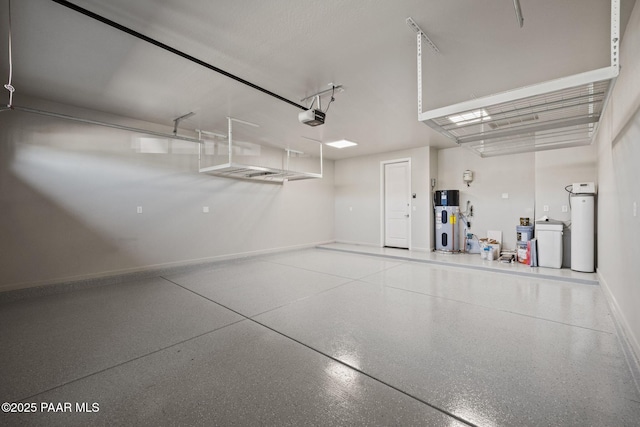 5268 Tranquil Bluff Way, Prescott, AZ 86301 - garage with heat pump water heater, a garage door opener, and baseboards