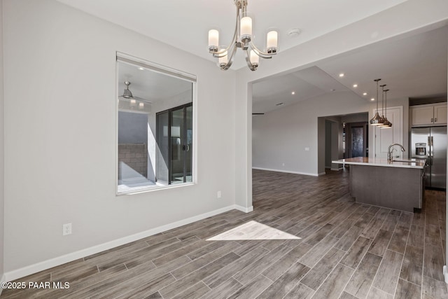 5268 Tranquil Bluff Way, Prescott, AZ 86301 - kitchen with stainless steel refrigerator with ice dispenser, light countertops, dark wood finished floors, a center island with sink, and vaulted ceiling