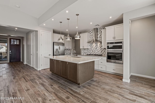5268 Tranquil Bluff Way, Prescott, AZ 86301 - kitchen with wall chimney exhaust hood, a sink, appliances with stainless steel finishes, light countertops, and decorative backsplash