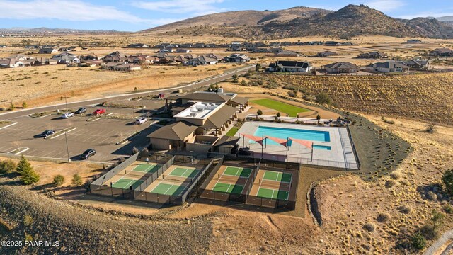 5268 Tranquil Bluff Way, Prescott, AZ 86301 - aerial view of property's location with a pool, a mountain backdrop, and nearby suburban area