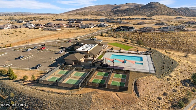 5268 Tranquil Bluff Way, Prescott, AZ 86301 - aerial view of property's location with a pool, a mountain backdrop, and nearby suburban area