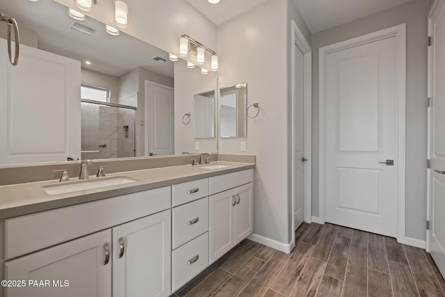 5268 Tranquil Bluff Way, Prescott, AZ 86301 - full bath with double vanity, a stall shower, baseboards, and wood finished floors