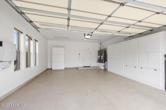 garage featuring a garage door opener and gas water heater