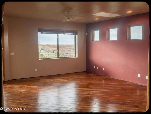 10614 E High Point Dr, Dewey-Humboldt, AZ 86327 - empty room featuring hardwood / wood-style flooring, ceiling fan, a skylight, and recessed lighting