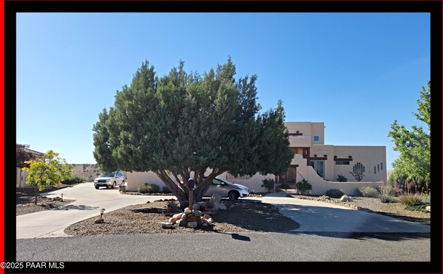 10614 E High Point Dr, Dewey-Humboldt, AZ 86327 - view of front of property with stucco siding and concrete driveway