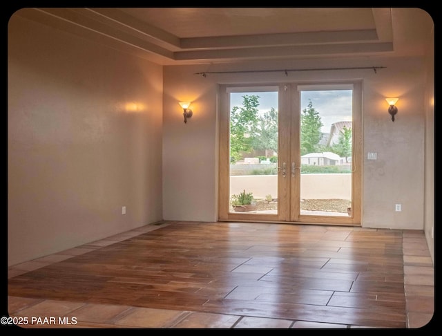 10614 E High Point Dr, Dewey-Humboldt, AZ 86327 - spare room with wood finished floors, a tray ceiling, and french doors