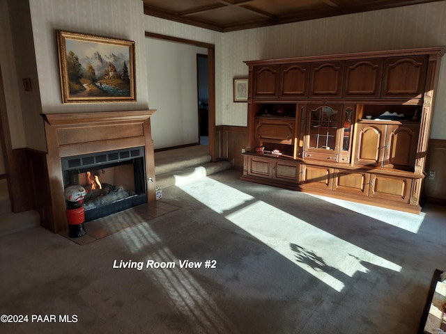 carpeted living room featuring coffered ceiling