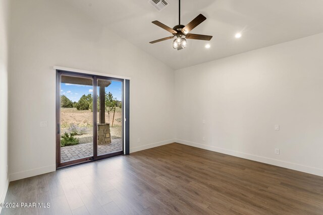 spare room featuring ceiling fan, high vaulted ceiling, and dark wood-type flooring