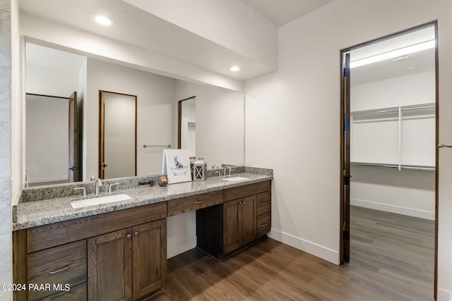 bathroom with hardwood / wood-style floors and vanity