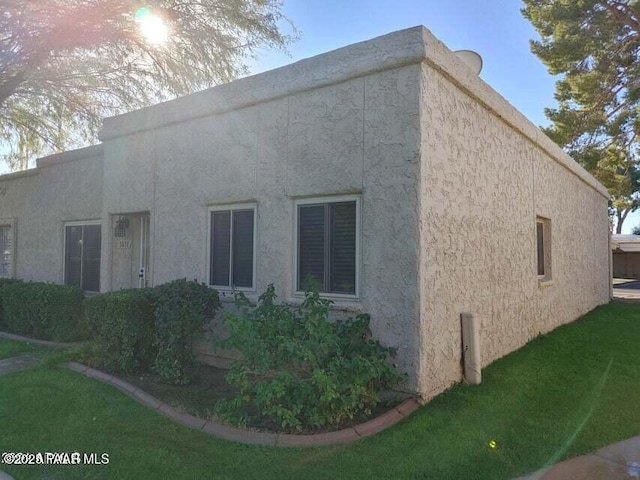 rear view of house with a lawn