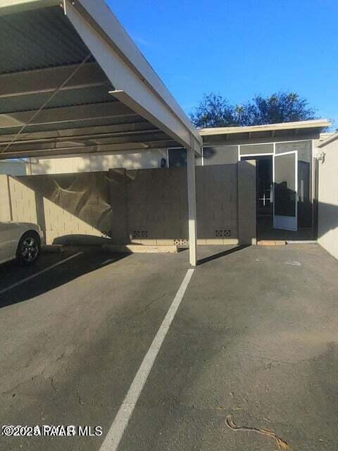 view of parking featuring a carport