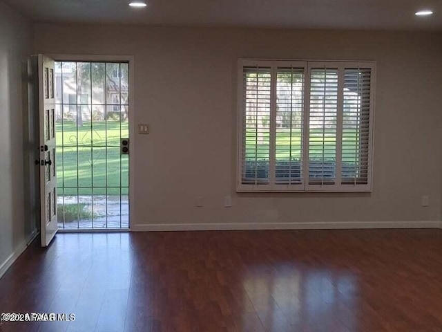 entryway with dark wood-type flooring