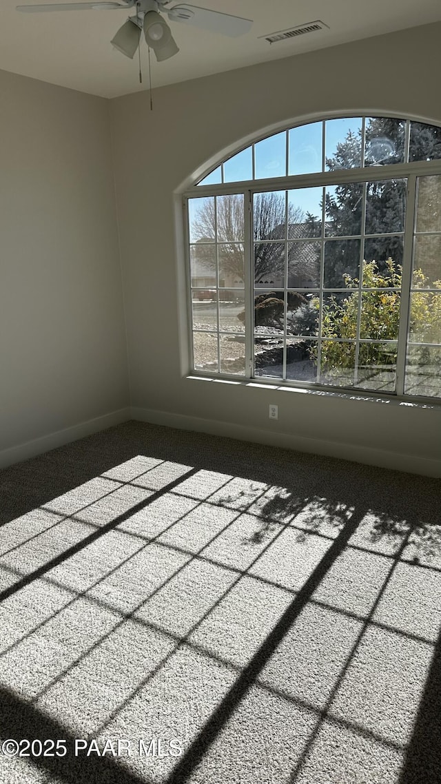 spare room with ceiling fan