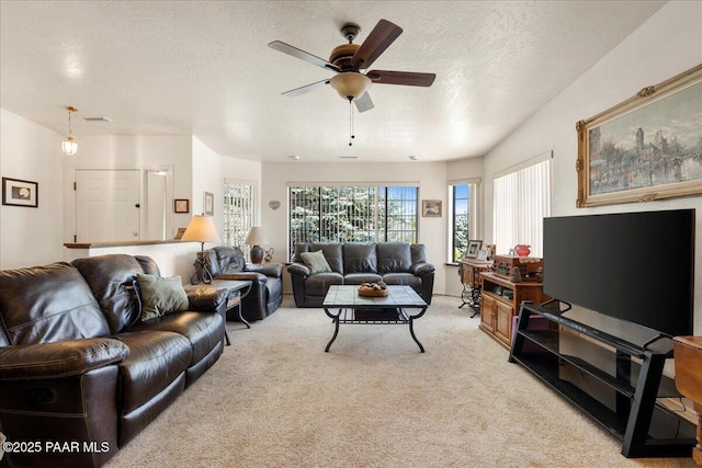 9331 Serpentine Ln, Prescott Valley, AZ 86314 - living area featuring light colored carpet, ceiling fan, and a textured ceiling