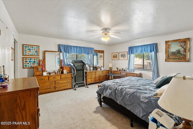 9331 Serpentine Ln, Prescott Valley, AZ 86314 - bedroom with light carpet, a textured ceiling, and ceiling fan