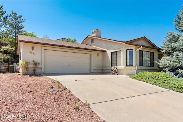 9331 Serpentine Ln, Prescott Valley, AZ 86314 - single story home with an attached garage, driveway, stucco siding, and a chimney