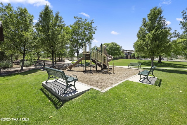 community jungle gym with a lawn