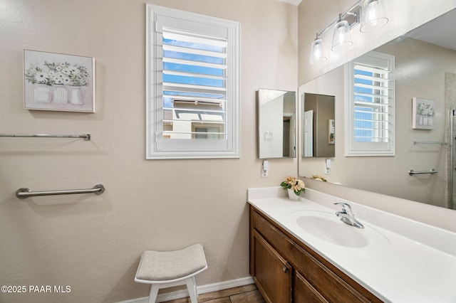 bathroom with baseboards and vanity