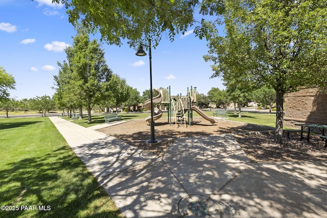 community jungle gym with a lawn