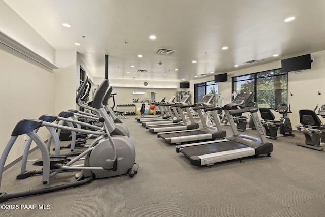 exercise room with visible vents and recessed lighting