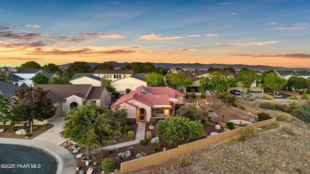 aerial view at dusk with a residential view