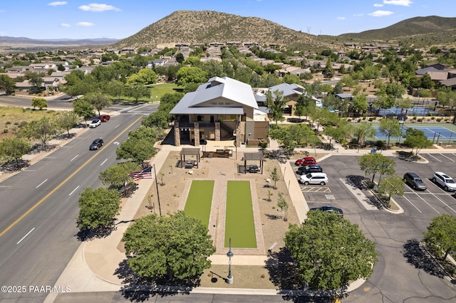 birds eye view of property with a mountain view