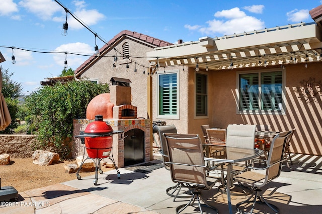 view of patio with outdoor dining area and an outdoor brick fireplace