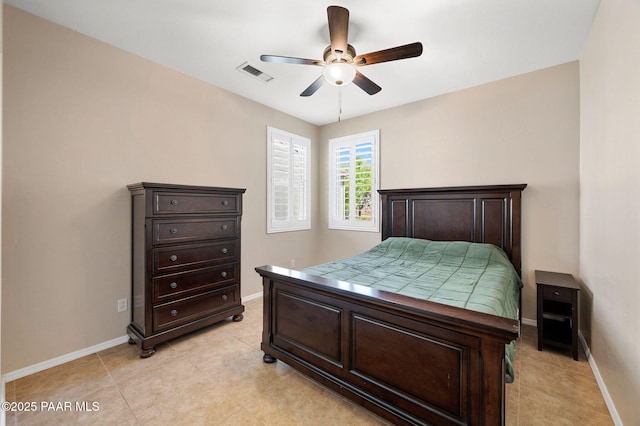 bedroom featuring a ceiling fan, light tile patterned floors, baseboards, and visible vents