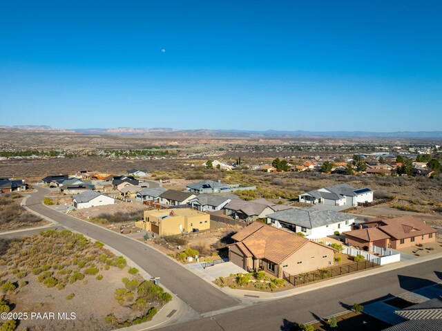 birds eye view of property featuring a mountain view and a residential view