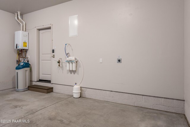 garage featuring tankless water heater