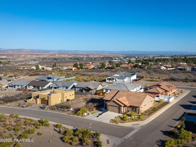 birds eye view of property with a mountain view and a residential view