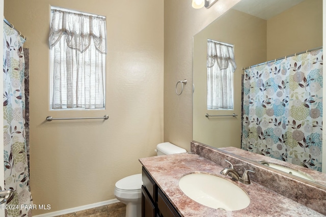 bathroom featuring tile patterned floors, vanity, toilet, and a shower with curtain