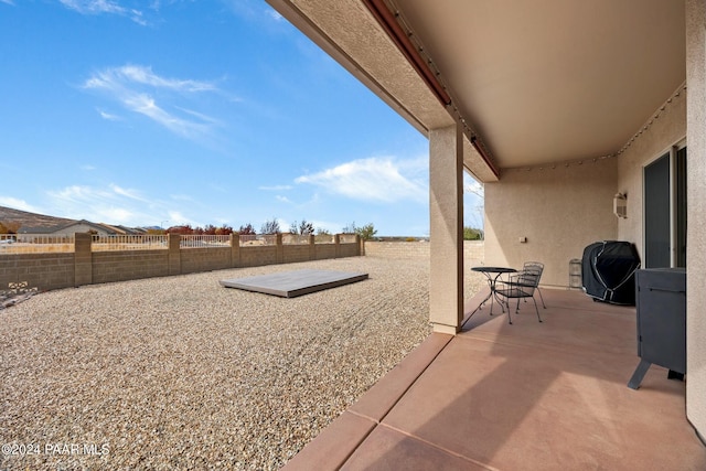 view of patio featuring a grill